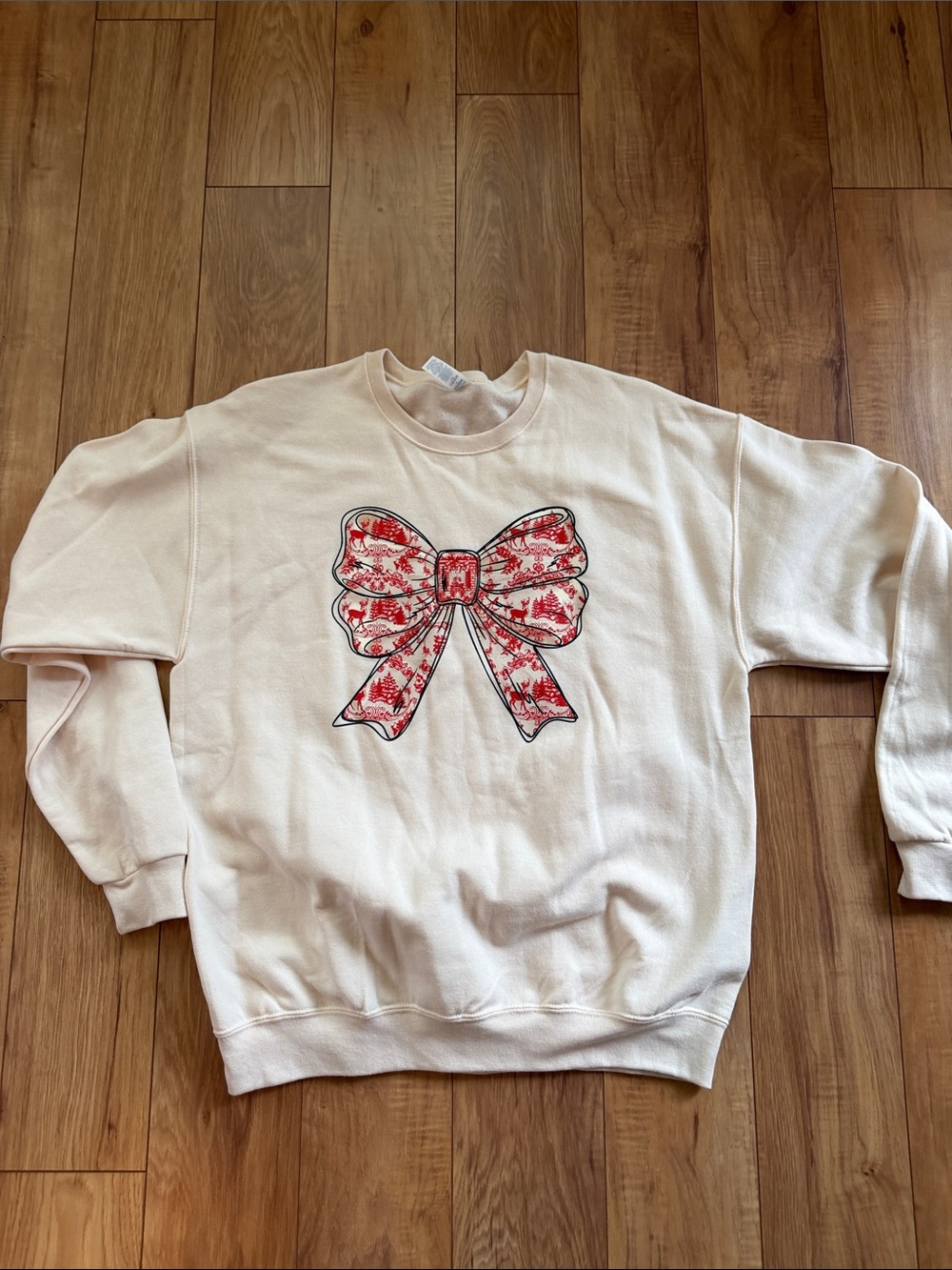 Women's Cream Crewneck Sweatshirt with Red Bow Graphic